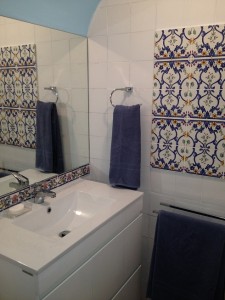 Portuguese Azulejo tiles have been discretely sprinkled through the apartment.